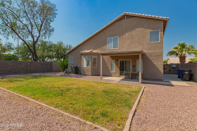 back of house featuring stucco siding, a patio area, and cooling unit