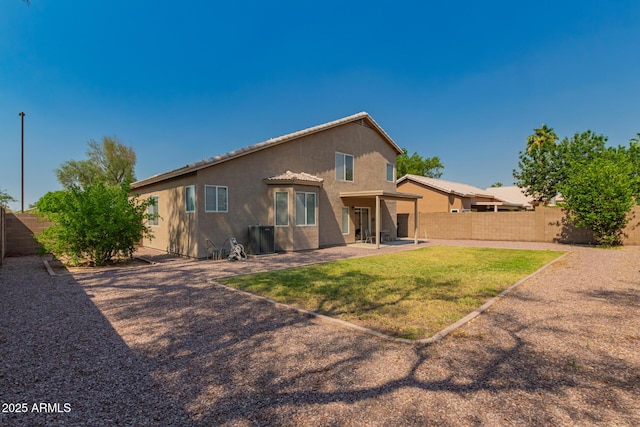 back of house featuring stucco siding, a patio area, and central AC unit