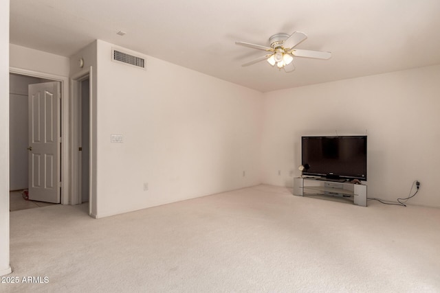 unfurnished living room with carpet floors and a ceiling fan