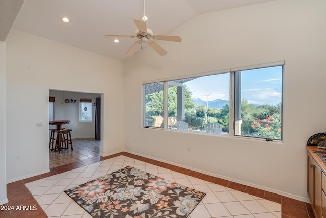 interior space featuring ceiling fan, high vaulted ceiling, and light hardwood / wood-style floors