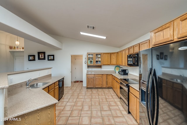 kitchen with lofted ceiling, black appliances, sink, light tile patterned floors, and decorative light fixtures