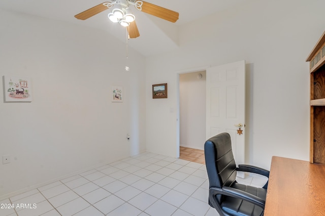 tiled office space featuring ceiling fan