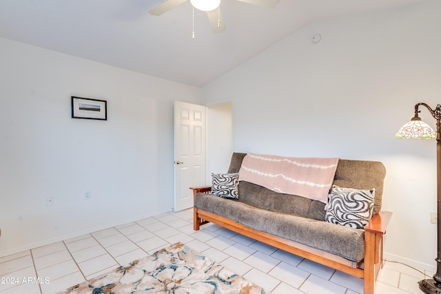 living area with ceiling fan, lofted ceiling, and light tile patterned floors