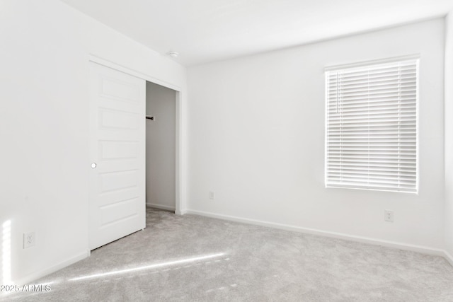 spare room with light colored carpet