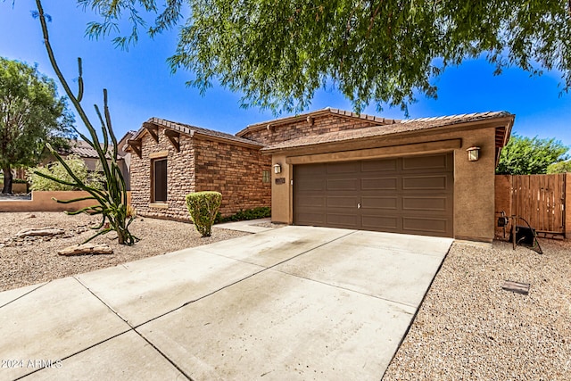 ranch-style home featuring a garage