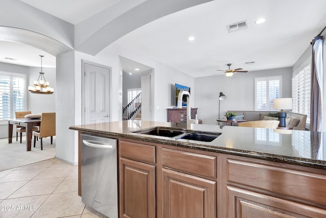 kitchen with pendant lighting, plenty of natural light, dishwasher, and sink