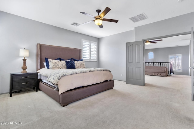 carpeted bedroom featuring ceiling fan