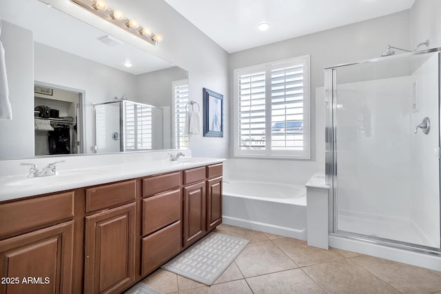 bathroom with vanity, shower with separate bathtub, and tile patterned flooring