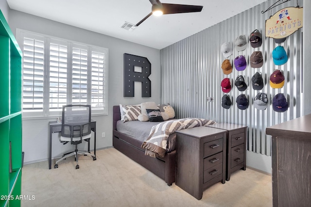 carpeted bedroom with ceiling fan