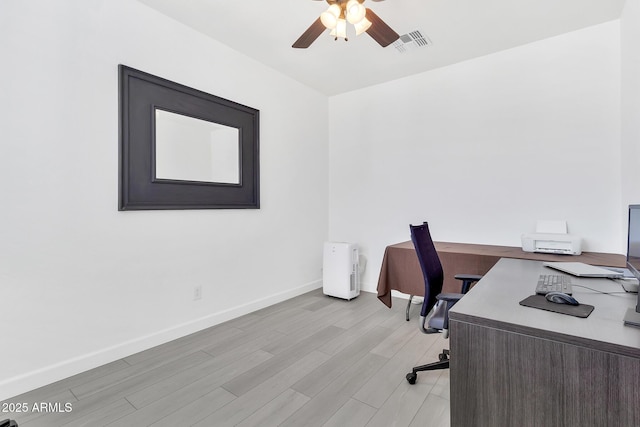 office with ceiling fan and light hardwood / wood-style floors