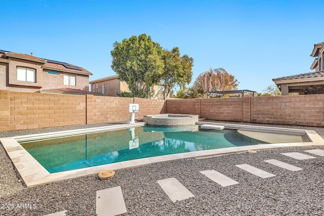 view of swimming pool featuring an in ground hot tub