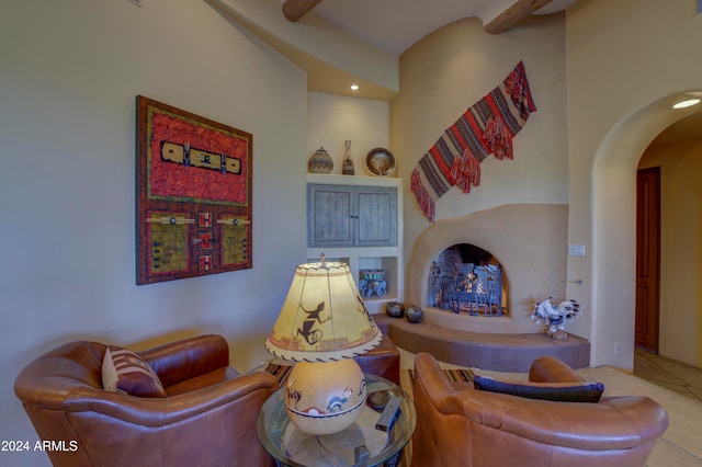 tiled living room featuring beamed ceiling