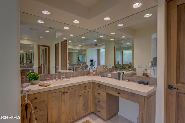 bathroom with vanity and backsplash