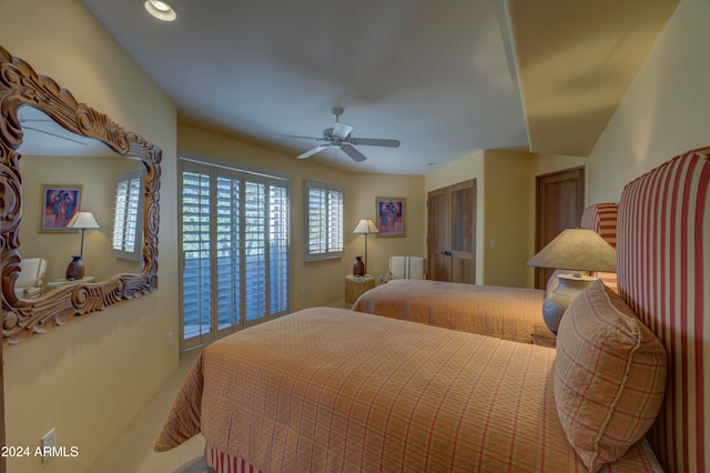 carpeted bedroom featuring ceiling fan