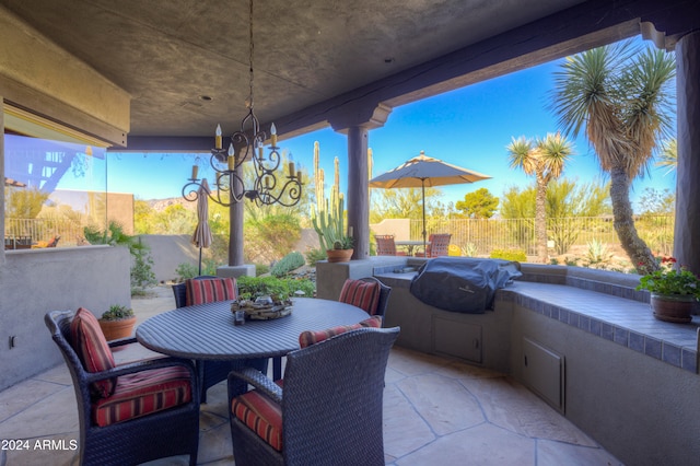 view of patio with area for grilling and an outdoor kitchen