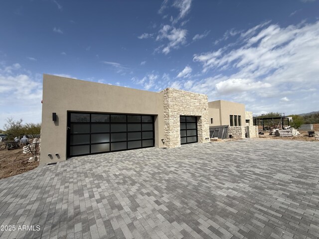 8167 E Leaning Rock Rd Unit 193, Scottsdale, AZ 85266 - view of front of home featuring stone siding and stucco siding