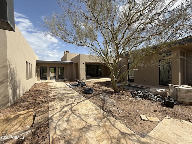 8167 E Leaning Rock Rd Unit 193, Scottsdale, AZ 85266 - rear view of house featuring a patio area and stucco siding