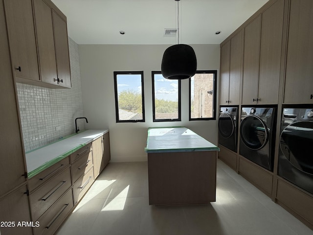 8167 E Leaning Rock Rd Unit 193, Scottsdale, AZ 85266 - laundry area with visible vents, light tile patterned floors, separate washer and dryer, a sink, and cabinet space