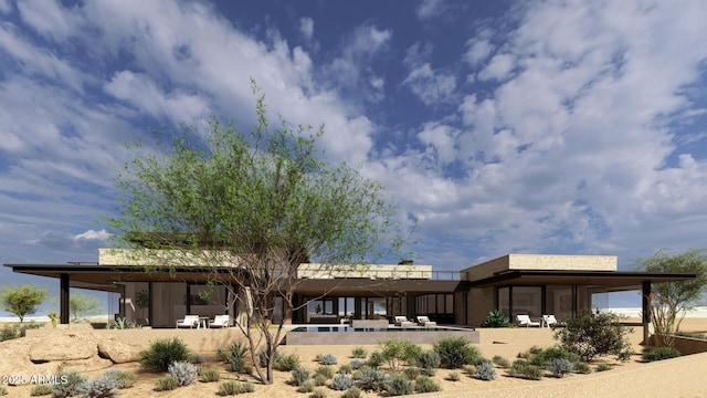 rear view of house with a patio