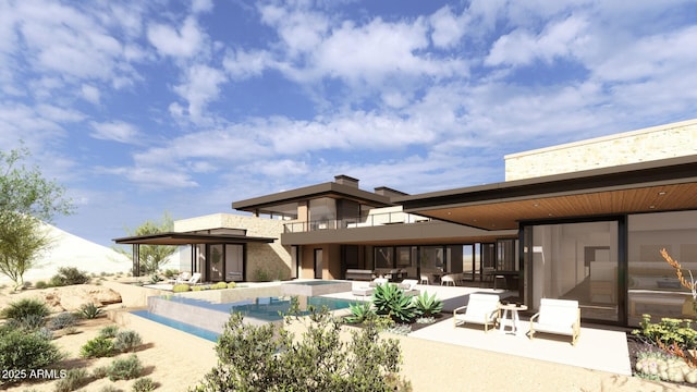 rear view of property with a patio area, a balcony, and an outdoor pool