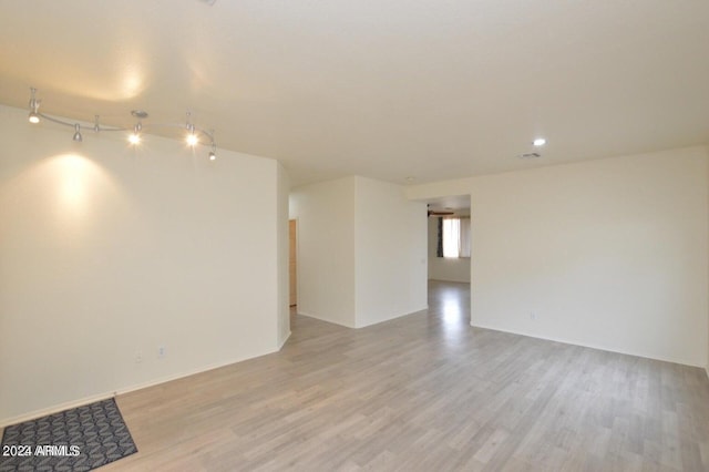 spare room with light wood-type flooring