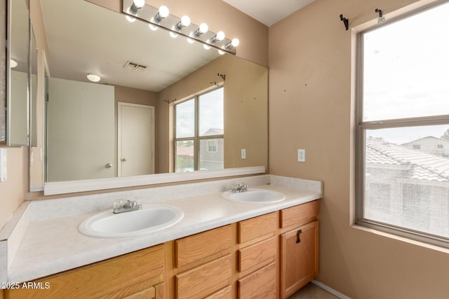 bathroom featuring double vanity