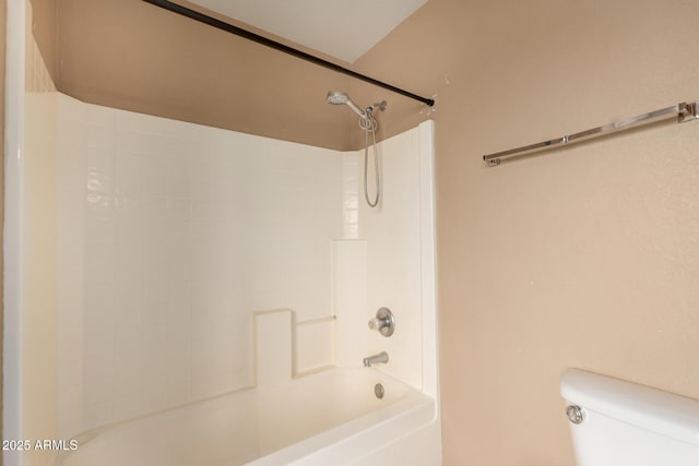 bathroom with toilet and tub / shower combination