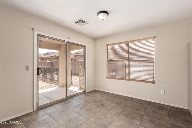 tiled spare room with baseboards