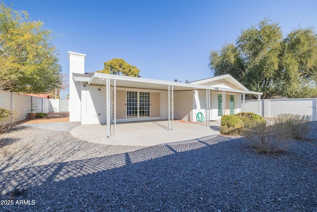 rear view of property with a patio area