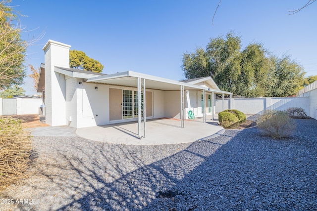 back of property featuring a patio area