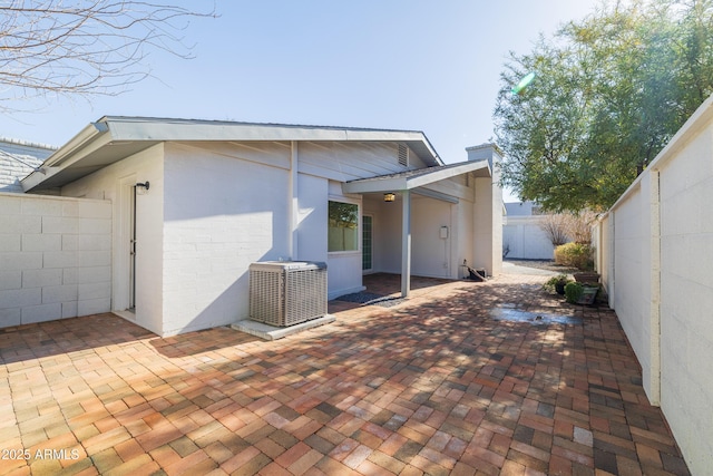 exterior space with a patio and central air condition unit