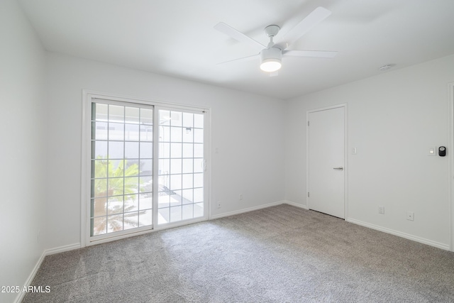 empty room featuring ceiling fan and carpet flooring