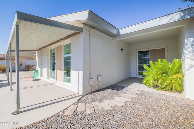 back of house with a patio