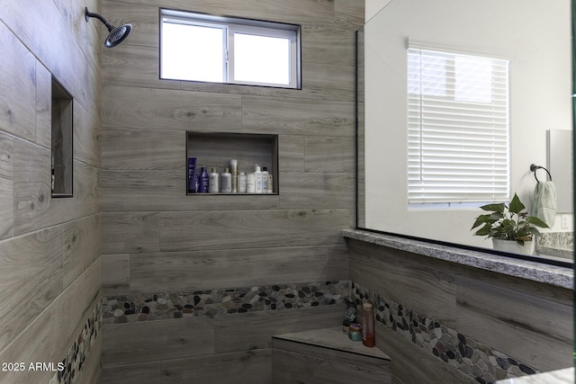 full bathroom with tiled shower