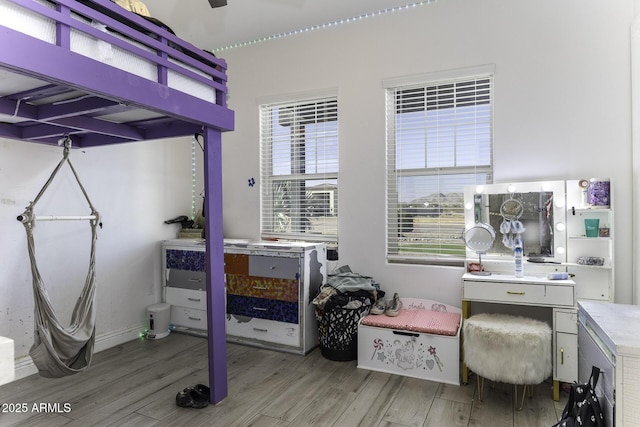 bedroom featuring wood finished floors