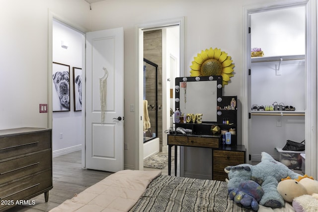 bedroom with wood finished floors