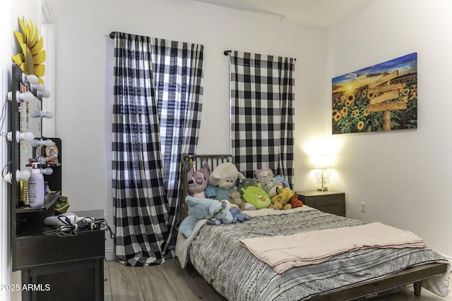 bedroom with wood finished floors