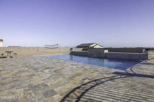 view of pool with a patio, a fenced backyard, and a fenced in pool