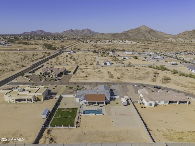 bird's eye view with view of desert and a mountain view