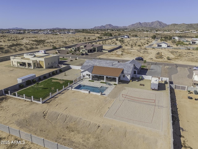 birds eye view of property featuring a mountain view and a desert view