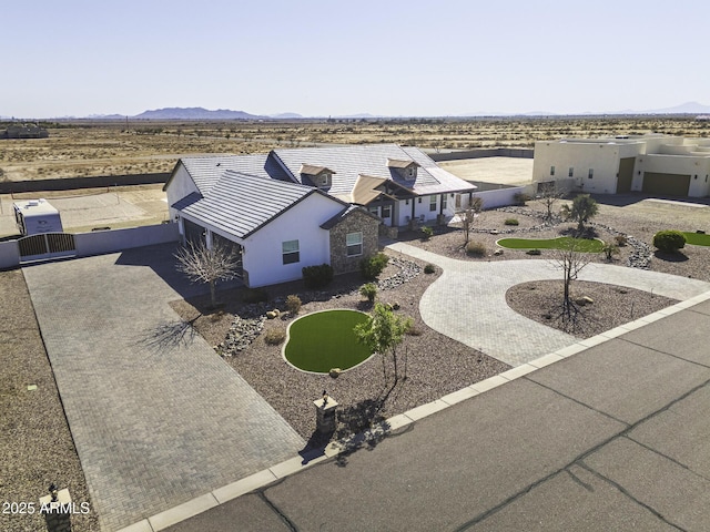 birds eye view of property with a mountain view