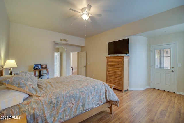 bedroom with ceiling fan and light hardwood / wood-style floors