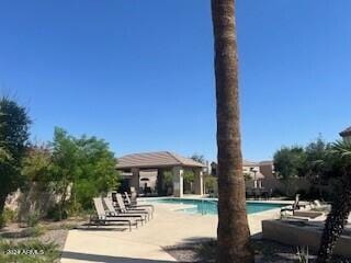 view of swimming pool with a patio area