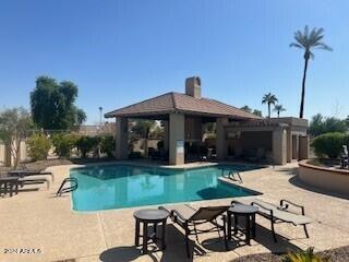 view of swimming pool featuring a gazebo and a patio