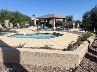 view of swimming pool featuring a gazebo and a patio