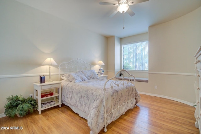 bedroom featuring hardwood / wood-style flooring and ceiling fan