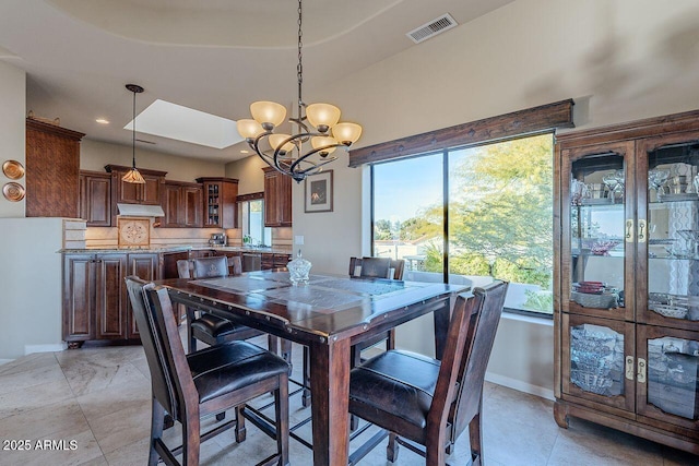 dining room with a chandelier