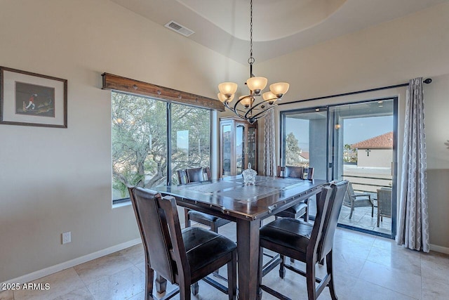 dining space featuring a notable chandelier and a wealth of natural light