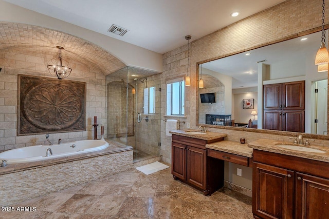 bathroom featuring vanity, lofted ceiling, and independent shower and bath