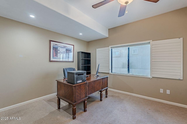 office featuring light carpet and ceiling fan